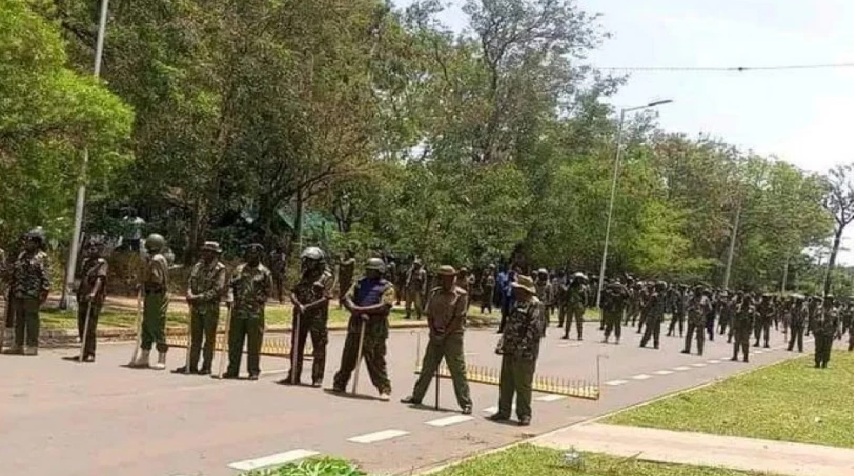 A past photo of security officers protecting entry into state house